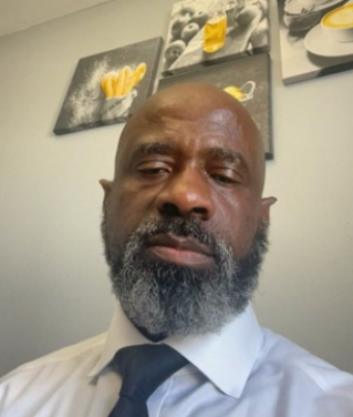 Two men in formalwear enjoying a comfortable ride in a luxury car, smiling.